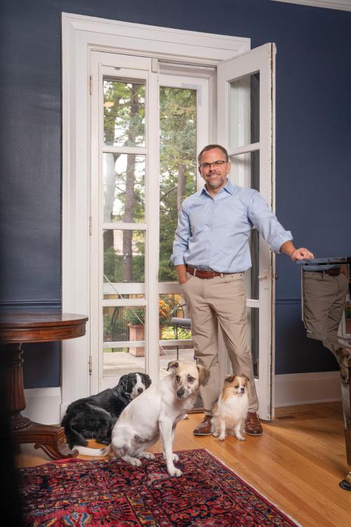 President Eric Bonyton with the three family dogs: Vivi, Jolene, and Talulah.